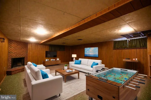 a outdoor living space with patio furniture and a fireplace