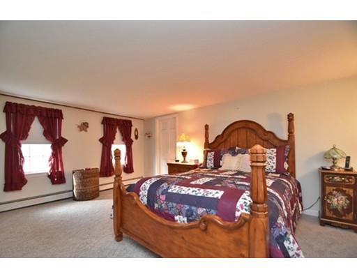 60 Hudson Road Oxford, MA 01540 - Photo 15 of 26 a bedroom with a bed a mirror and dresser