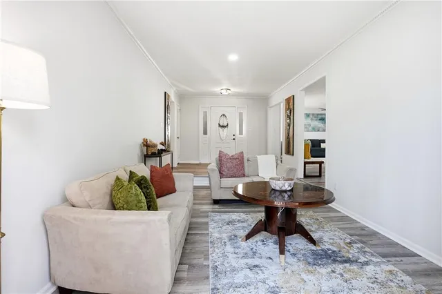 a living room with furniture and a table