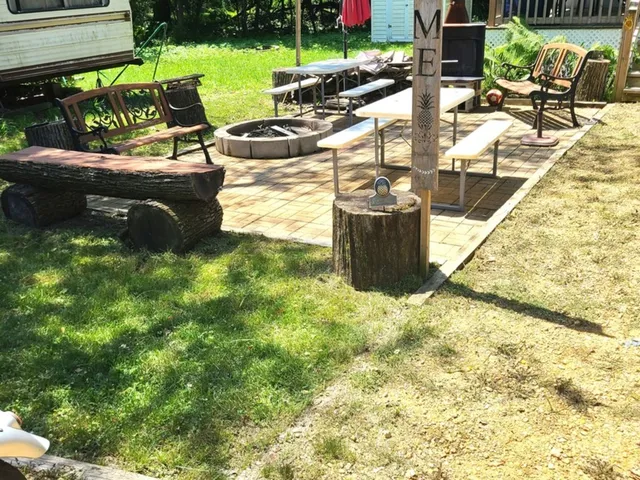 a view of a backyard with sitting area