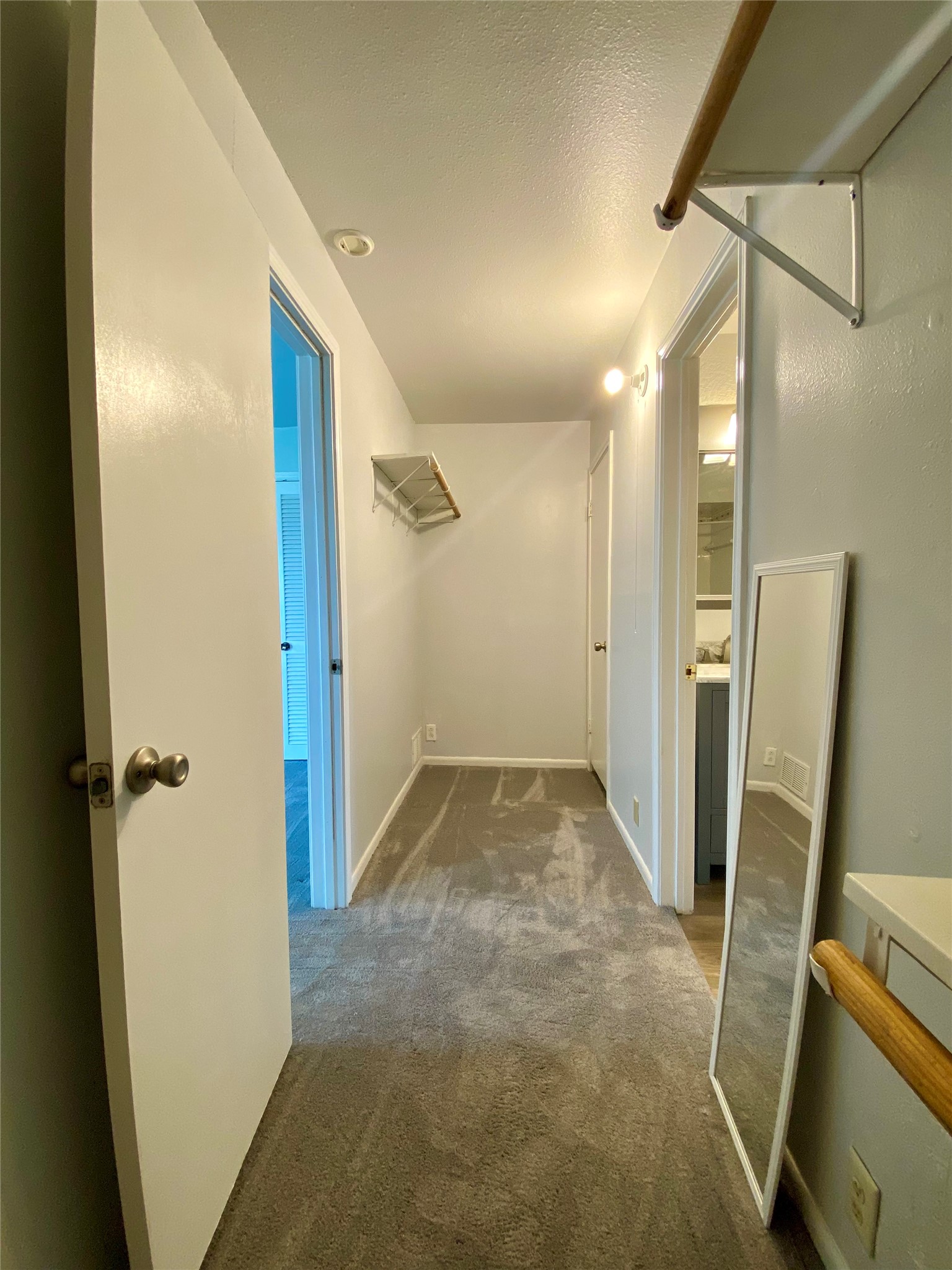 102 Redfish Drive Freeport, TX 77541 - Photo 22 of 44 a view of a hallway with a door