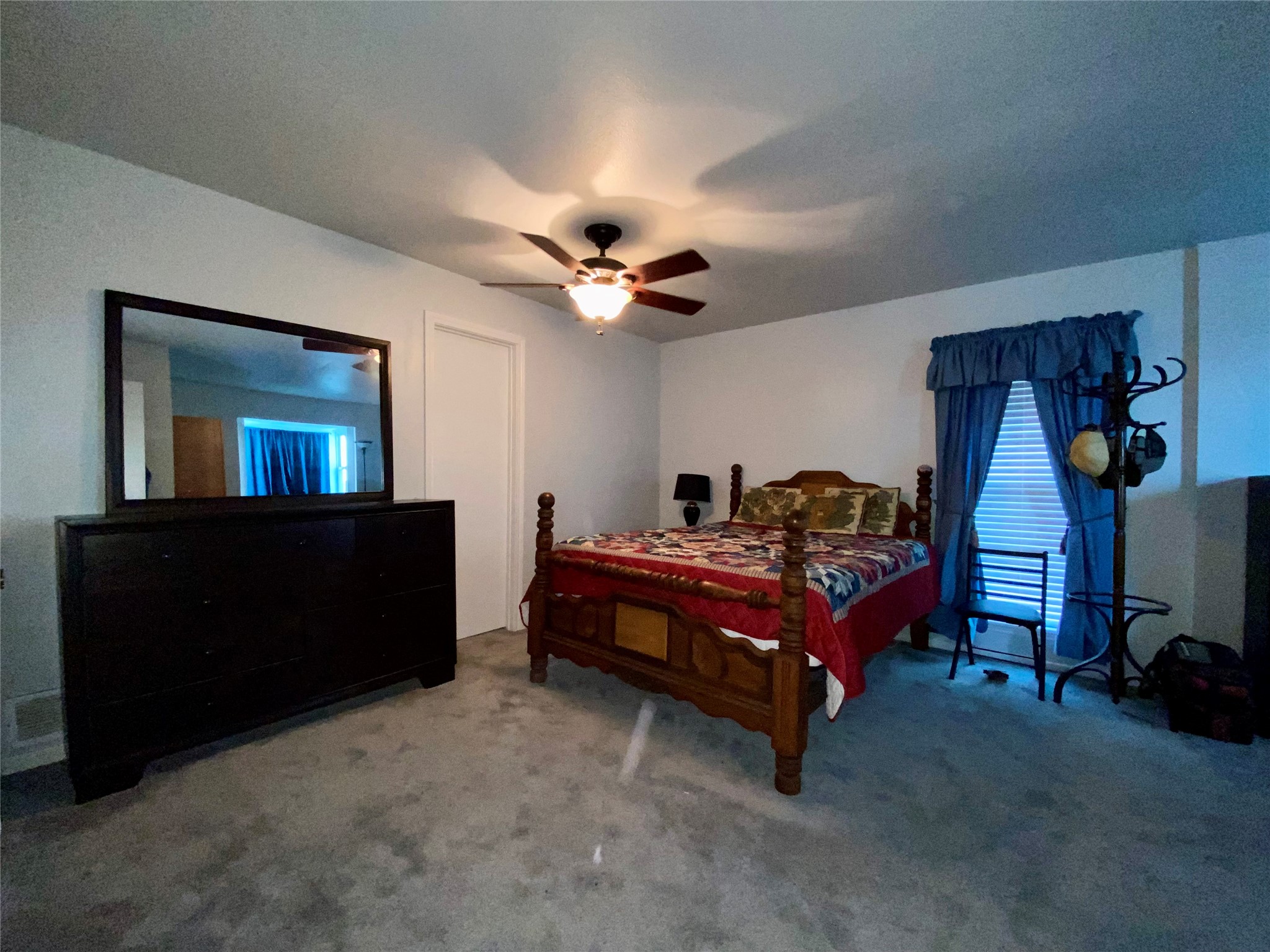 102 Redfish Drive Freeport, TX 77541 - Photo 24 of 44 a bed room with a bed and a chandelier