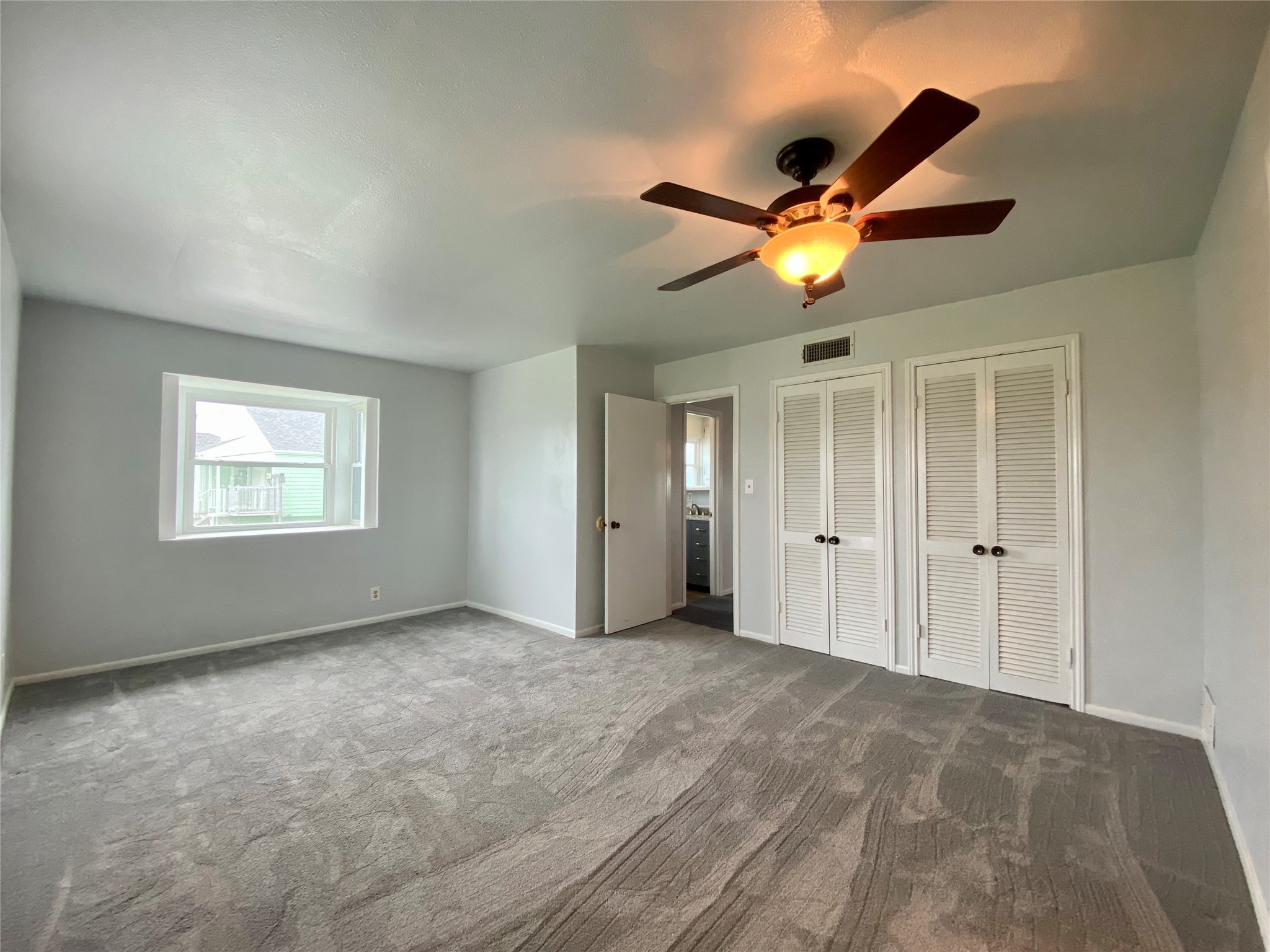 102 Redfish Drive Freeport, TX 77541 - Photo 26 of 44 a view of an empty room and a ceiling fan