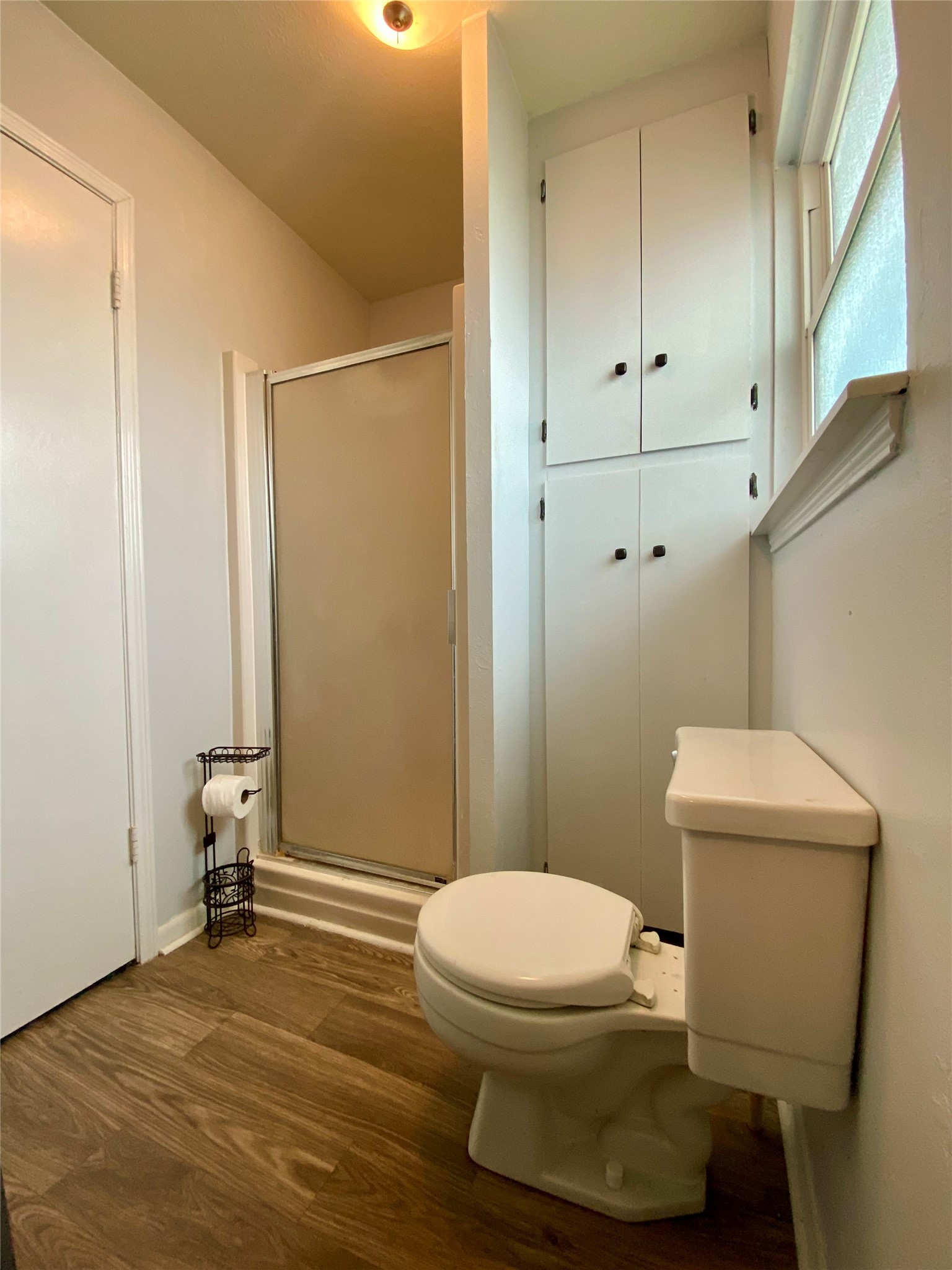 102 Redfish Drive Freeport, TX 77541 - Photo 28 of 44 a white toilet sitting next to a bathroom sink