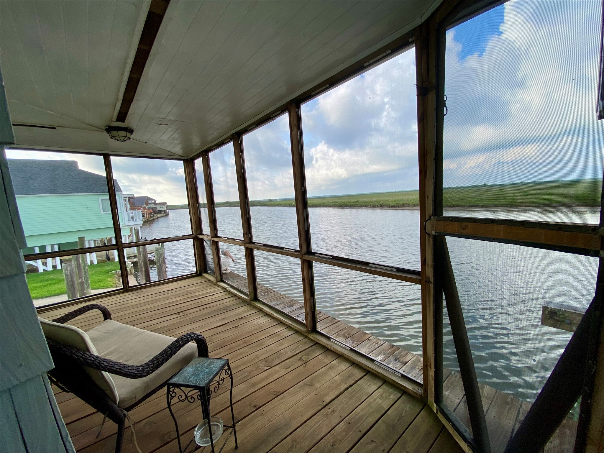 102 Redfish Drive Freeport, TX 77541 - Photo 31 of 44 a view of a balcony with wooden floor