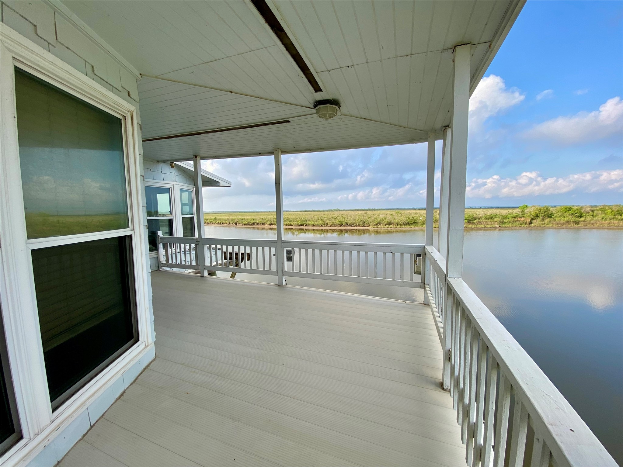 102 Redfish Drive Freeport, TX 77541 - Photo 33 of 44 a view of an ocean from a balcony