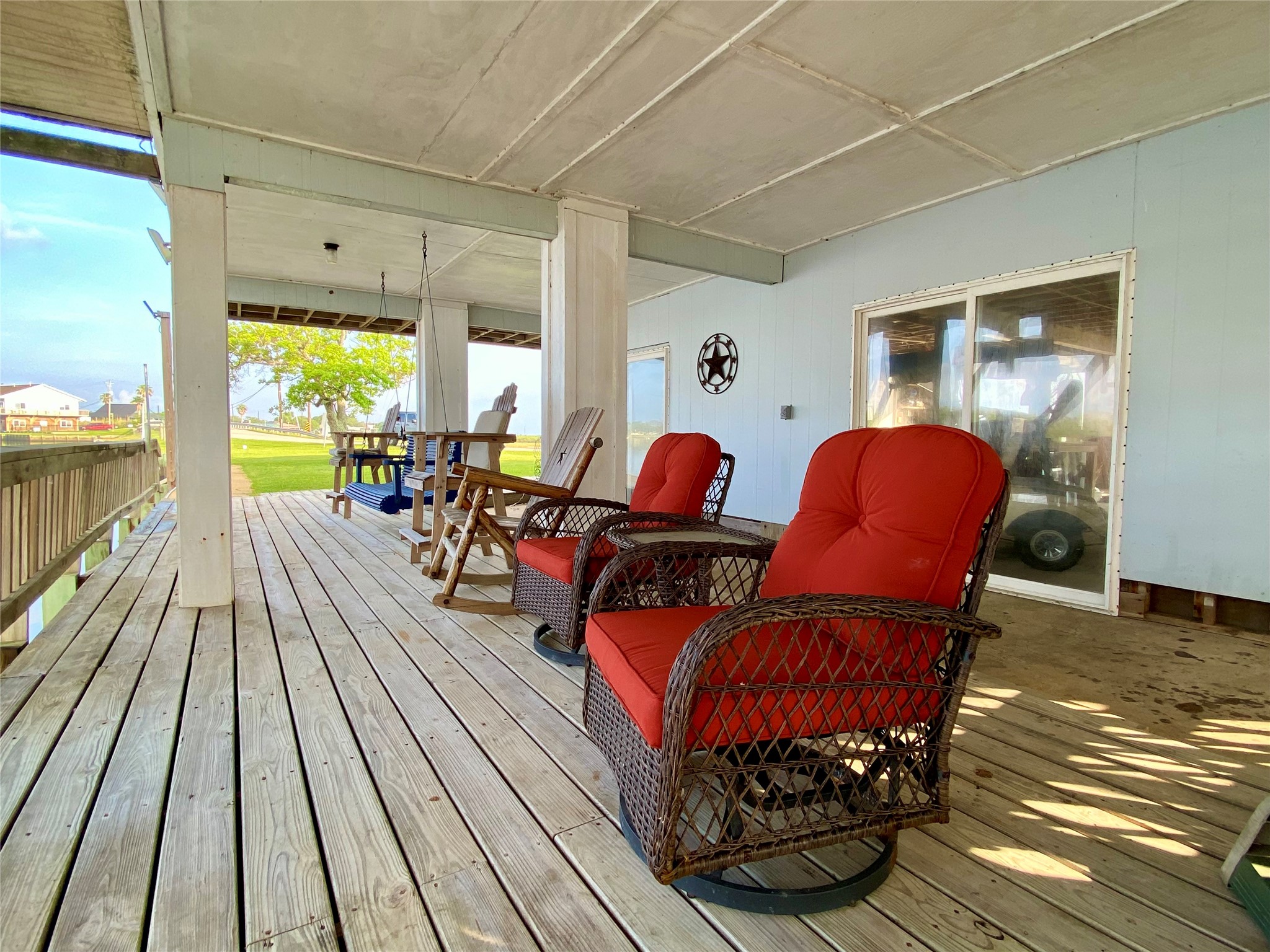 102 Redfish Drive Freeport, TX 77541 - Photo 38 of 44 a living room with furniture a large window with wooden floor