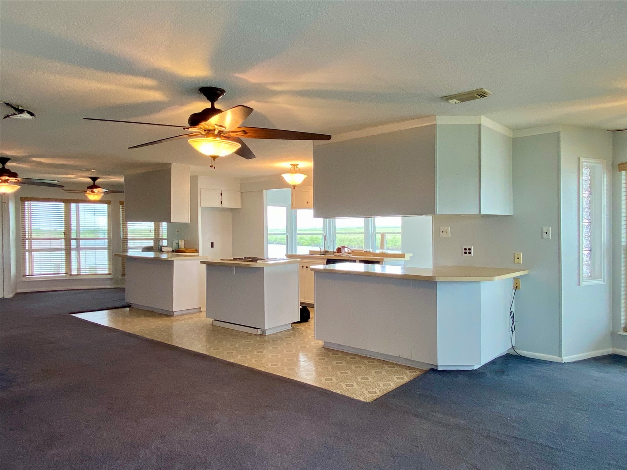 102 Redfish Drive Freeport, TX 77541 - Photo 7 of 44 a large kitchen with kitchen island a sink stainless steel appliances and cabinets