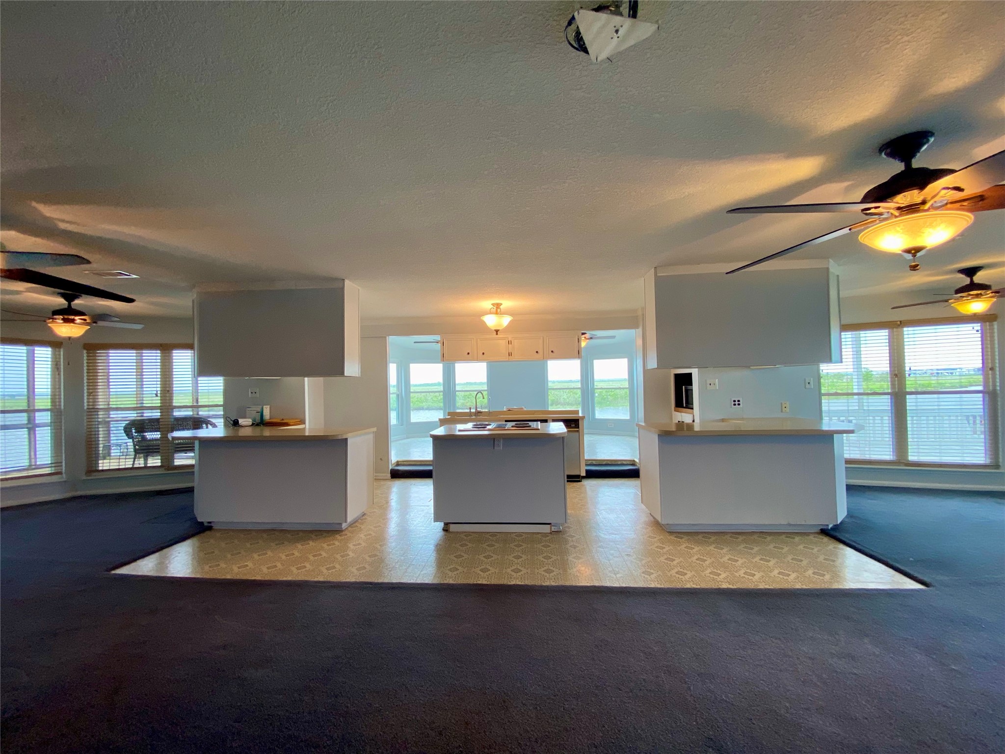 102 Redfish Drive Freeport, TX 77541 - Photo 9 of 44 a living room with couches and kitchen view with wooden floor