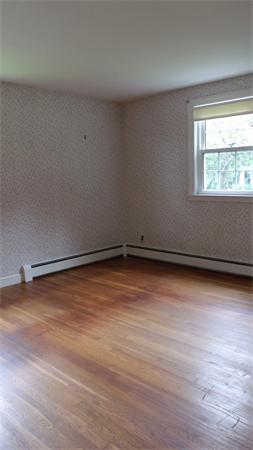 9 Patton Road Salem, MA 01970 - Photo 8 of 12 a view of a room with wooden floor and small window