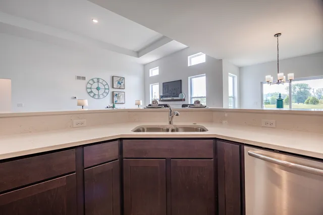 a kitchen with a sink and cabinets