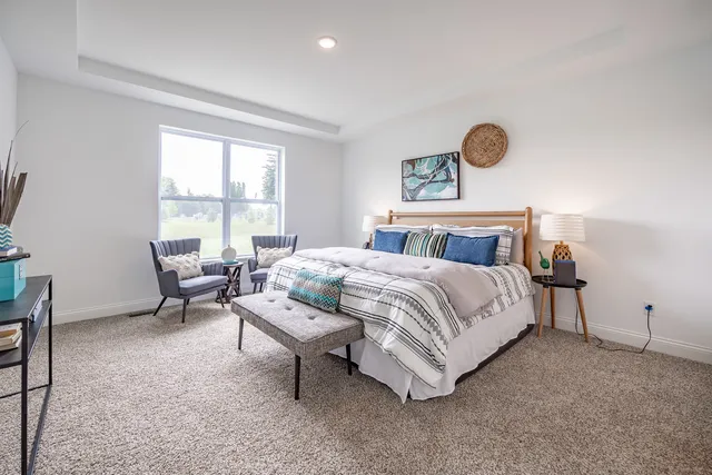 a bedroom with bed and window