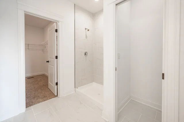 a bathroom with a tub and shower
