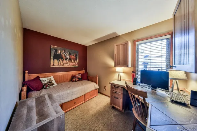 a bedroom with furniture and a window