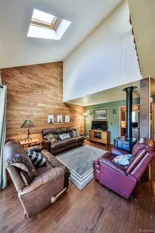 a living room with furniture fireplace and flat screen tv