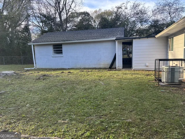 a backyard of a house with lots of green space