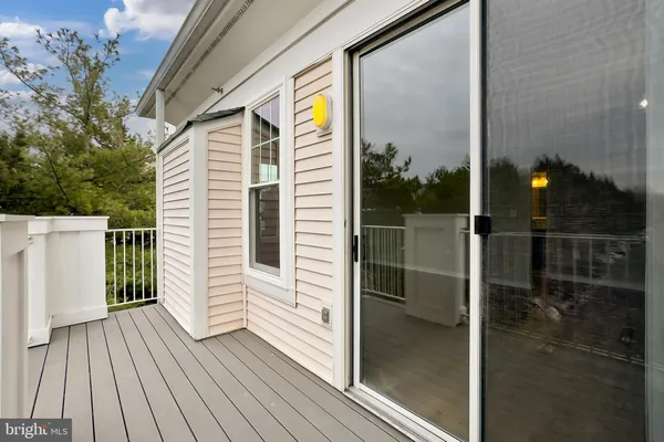 a view of a balcony with wooden floor
