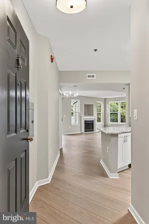 a view of an entryway with wooden floor