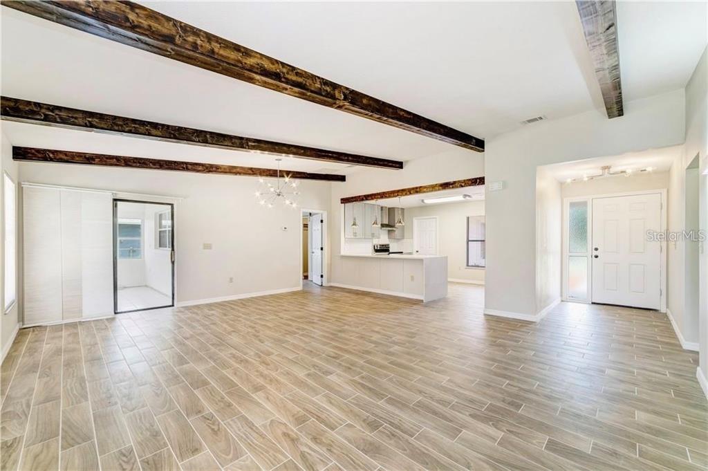 612 Estrada Lane Kissimmee, FL 34758 - Photo 4 of 8 a view of empty room with wooden floor