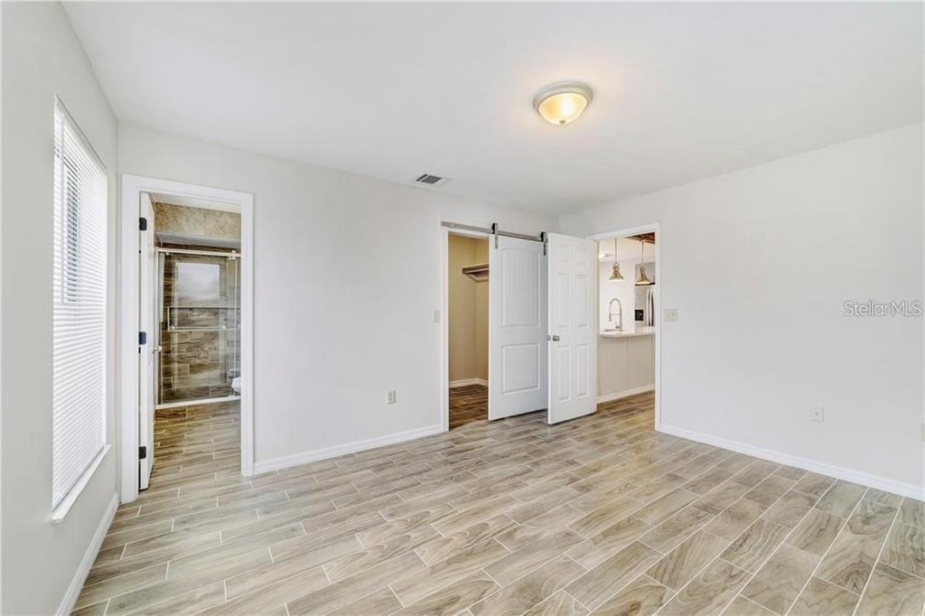 612 Estrada Lane Kissimmee, FL 34758 - Photo 6 of 8 wooden floor in an empty room