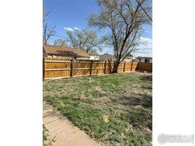 a view of front house with a yard