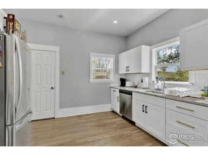 a bathroom with a sink and a window