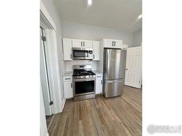 a room with cabinet and a window