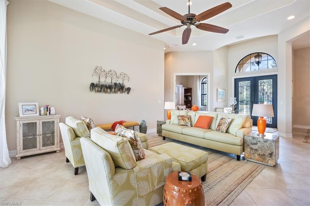 6504 Costa Circle Naples, FL 34113 - Photo 4 of 25 Living area with recessed lighting, a ceiling fan, baseboards, and light tile patterned floors