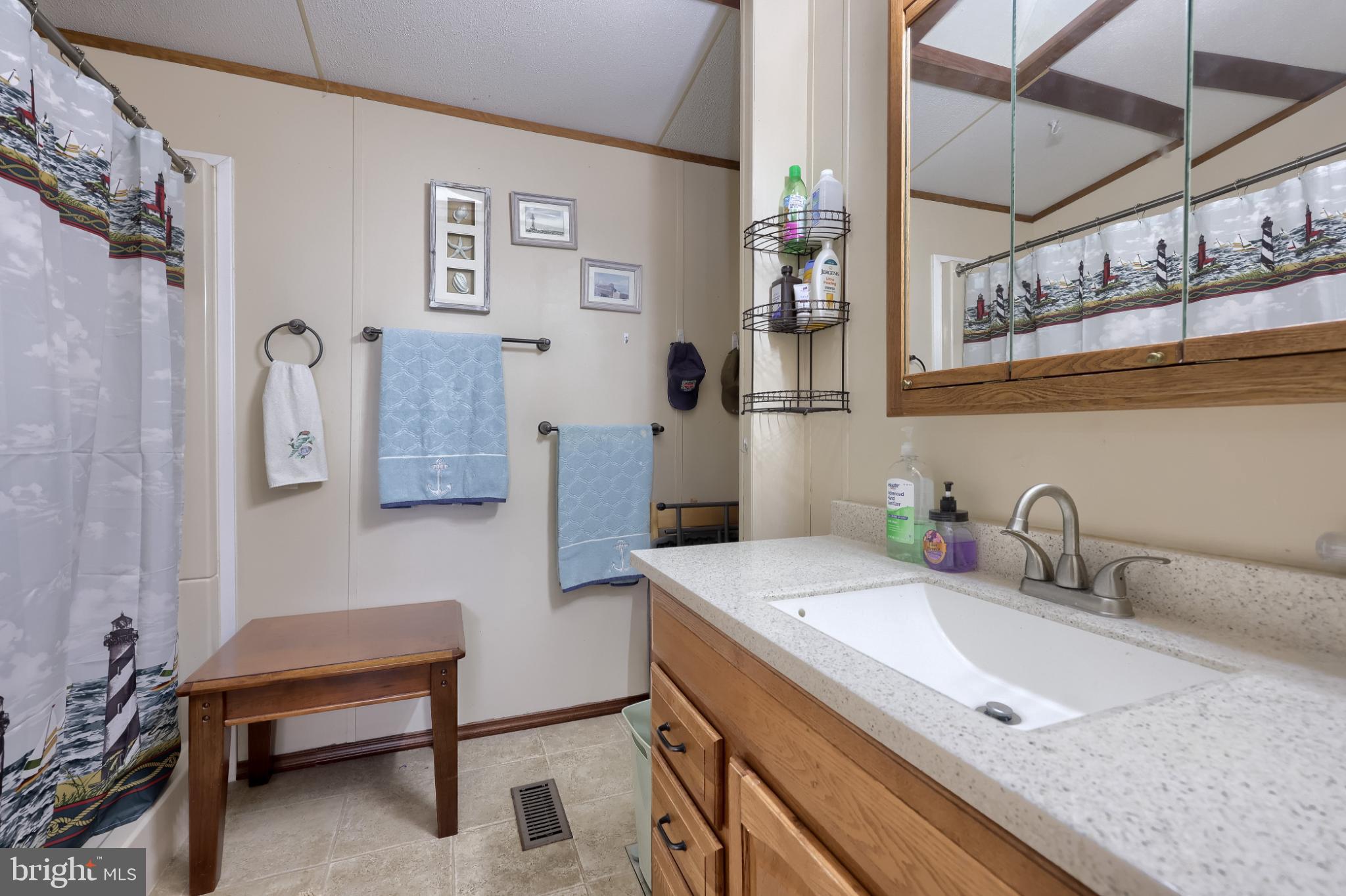 104 Fox Run Court Lancaster, PA 17603 - Photo 15 of 17 a bathroom with a sink and a mirror