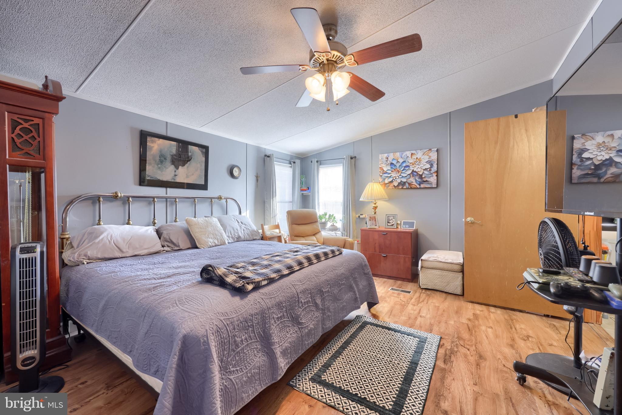 104 Fox Run Court Lancaster, PA 17603 - Photo 16 of 17 a bedroom with a bed and wooden floor