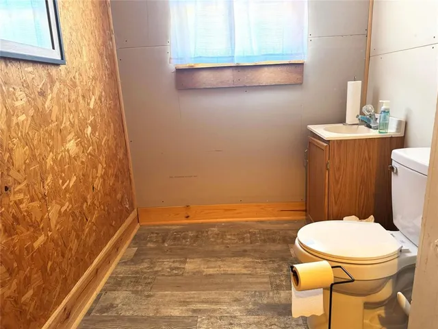 a bathroom with a toilet sink and a shower