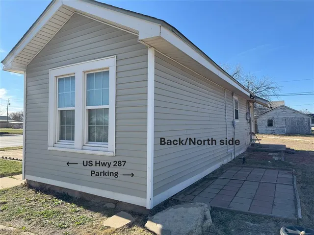 a view of a street with a building
