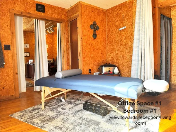 a room with a bed and a window