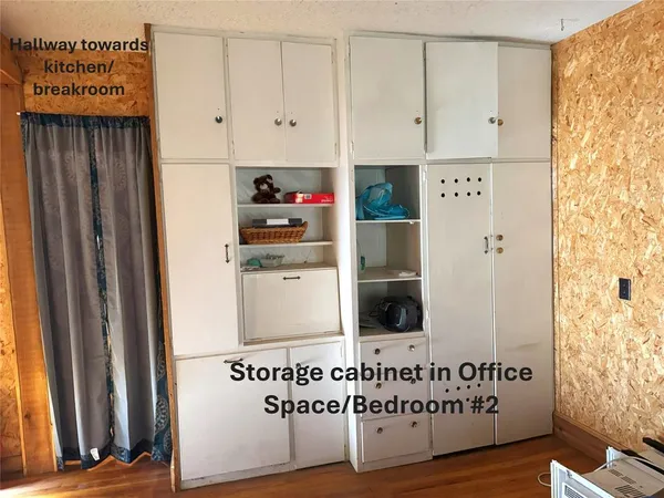 a view of cabinets with wooden floor