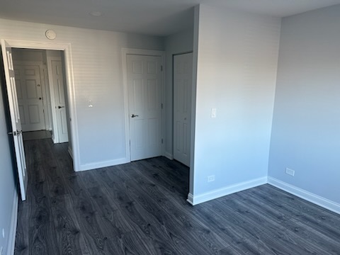 239 North Mill Road, Unit 310 Addison, IL 60101 - Photo 12 of 23 a view of a hallway with wooden floor