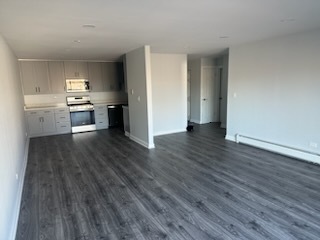 239 North Mill Road, Unit 310 Addison, IL 60101 - Photo 13 of 23 a kitchen with a refrigerator and a stove top oven