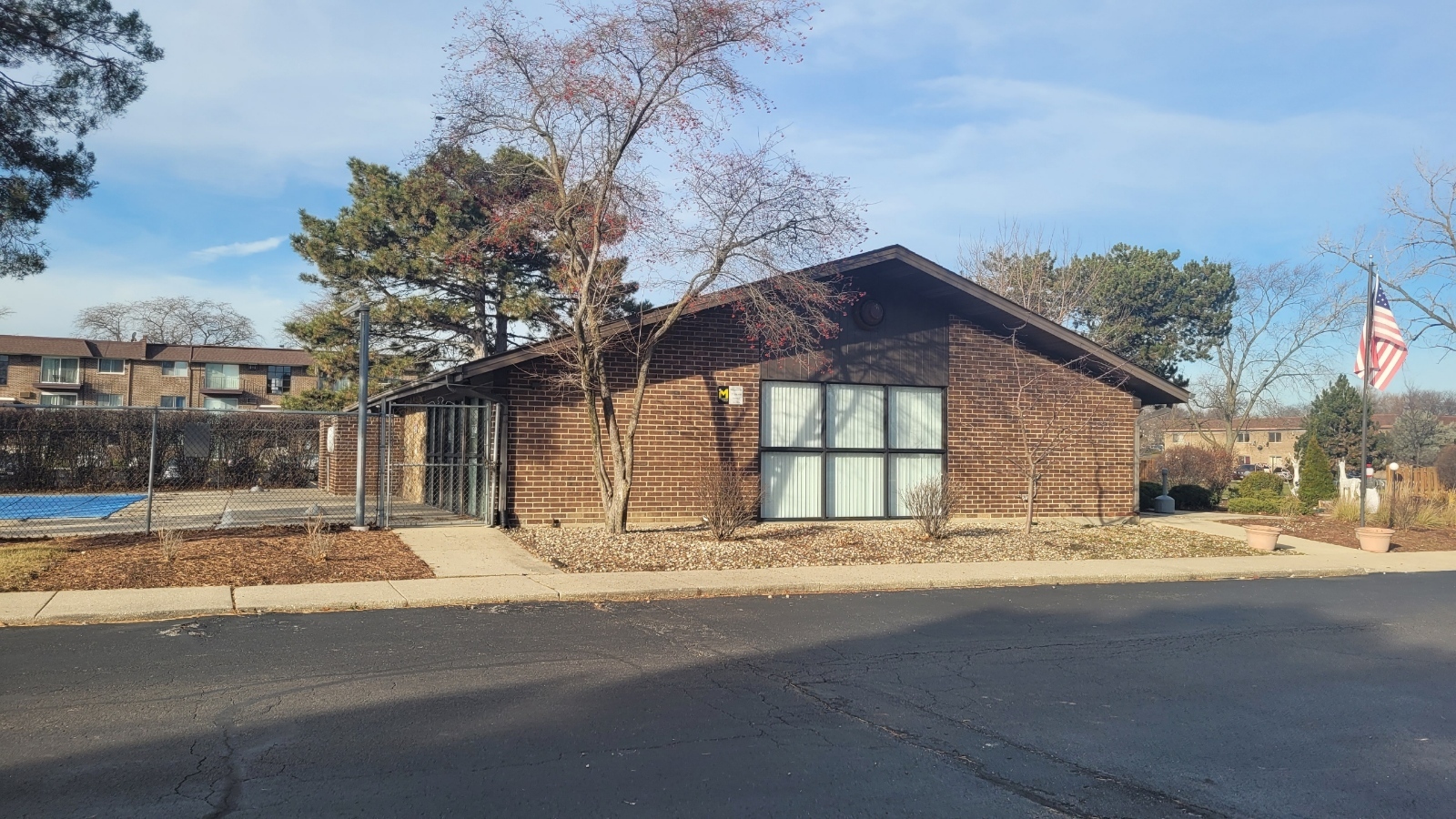 239 North Mill Road, Unit 310 Addison, IL 60101 - Photo 23 of 23 a house with trees in front of it