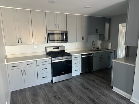 239 North Mill Road, Unit 310 Addison, IL 60101 - Photo 7 of 23 a kitchen with granite countertop a sink cabinets and stainless steel appliances