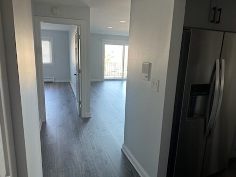 239 North Mill Road, Unit 310 Addison, IL 60101 - Photo 10 of 23 a view of a hallway with wooden floor and closet area