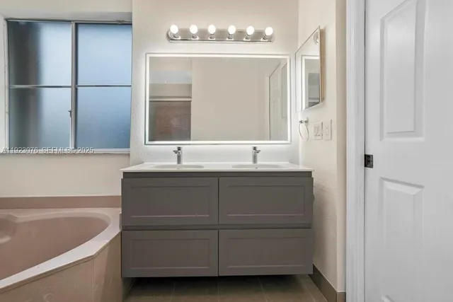 a bathroom with a sink and a bathtub