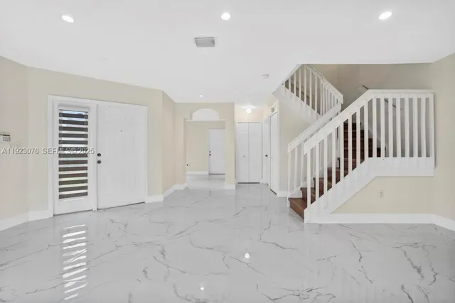 a view of an entryway with staircase