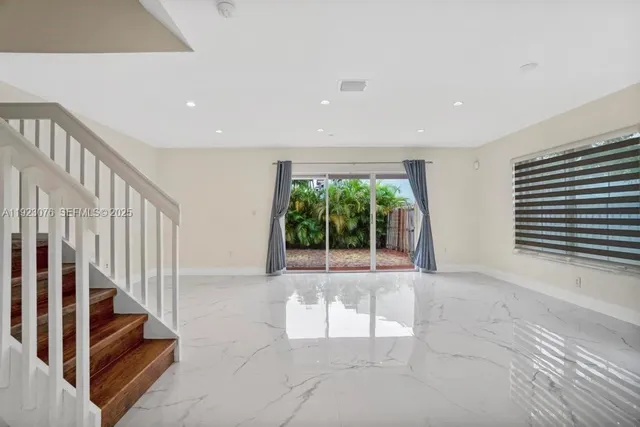 a view of a house with a wooden fence