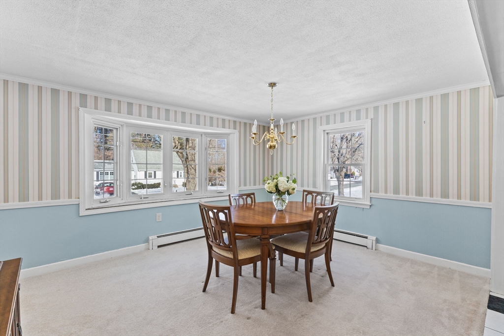 39 MacDonald Circle Walpole, MA 02081 - Photo 18 of 38 a view of a dining room with furniture and window