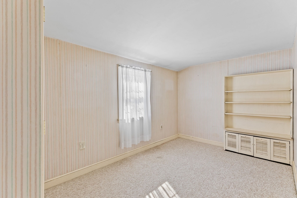 39 MacDonald Circle Walpole, MA 02081 - Photo 23 of 38 a view of an empty room with a window