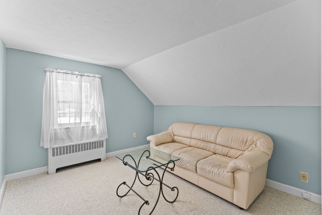 39 MacDonald Circle Walpole, MA 02081 - Photo 25 of 38 a living room with furniture and a window