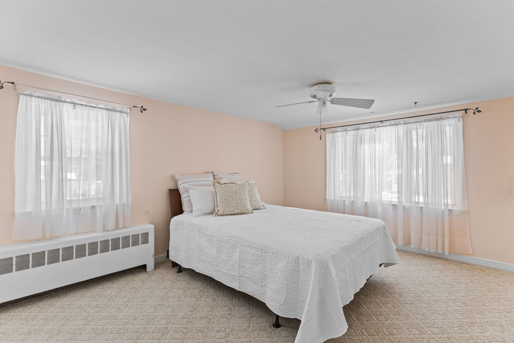 39 MacDonald Circle Walpole, MA 02081 - Photo 28 of 38 a bedroom with a bed and a window