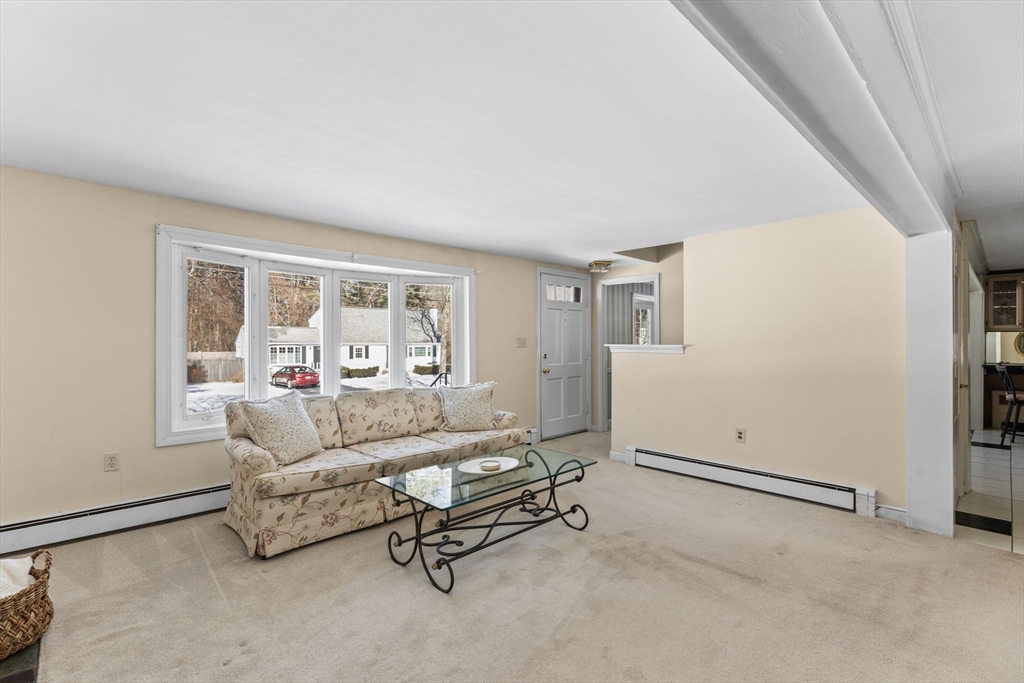 39 MacDonald Circle Walpole, MA 02081 - Photo 5 of 38 a living room with furniture and a window