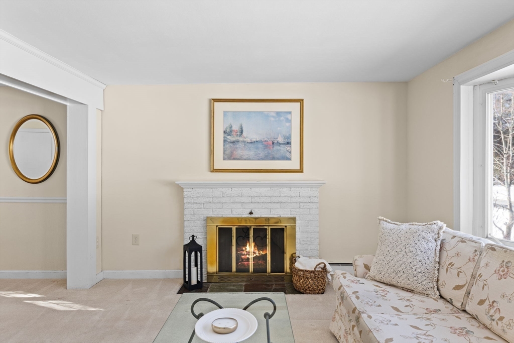 39 MacDonald Circle Walpole, MA 02081 - Photo 7 of 38 a living room with furniture a window and a fireplace