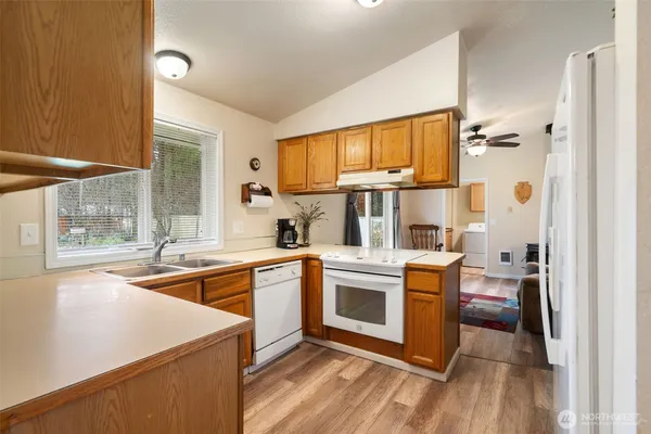 a white refrigerator freezer sitting inside of a kitchen