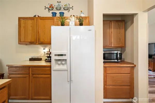a kitchen that has a sink and a stove in it